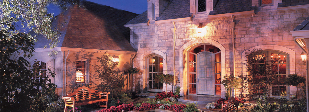 Serrano Front Elevation Provincial French manor house with limestone façade and stone courtyard